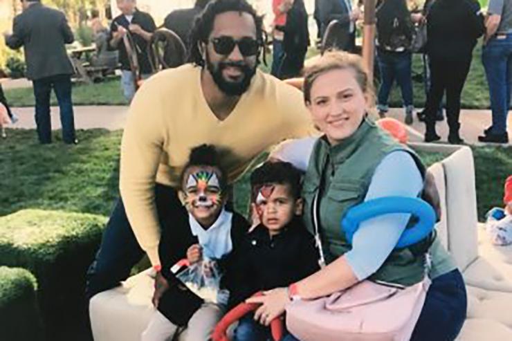 Smiling parents and two children